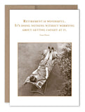 The "Retirement Is Wonderful Retirement Card" by Shannon Martin Design features a vintage-style photo of a person relaxing on a lounge chair outdoors, beautifully printed on recycled paper. The card includes the humorous quote from Gene Perret: "Retirement is wonderful. It's doing nothing without worrying about getting caught at it." It is elegantly presented in a charming Kraft envelope.