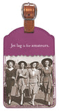 The Jet Lag Luggage Tag by Shannon Martin Design showcases a vintage aesthetic, featuring an image of four women dressed in 1940s attire, each clutching a suitcase. The top of this purple leatherette luggage tag boldly states, "Jet lag is for amateurs." It includes an enclosed contact card and is elegantly finished with a copper metallic strap.