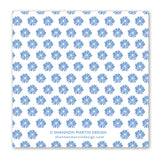 A white square background displays a repeating pattern of blue sunbursts, vintage-inspired. At the bottom center, “Hats Off Napkin” by Shannon Martin Design and shannonmartindesign.com appear in gray letters.