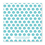 The Cake & Eat It, Too Napkin by Shannon Martin Design is a white square beverage napkin with teal sunburst patterns and “© Shannon Martin Design” plus “shannonmartindesign.com” at the bottom center.