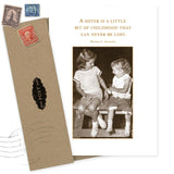 The "A Sister Is Birthday Card" by Shannon Martin Design features a sepia photo of two smiling girls and the quote, "A sister is a little bit of childhood that can never be lost." Made in the USA. Includes brown envelope and vintage stamps.