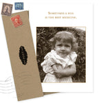 The Hug Best Medicine Get Well Card by Shannon Martin Design features a sepia photo of a curly-haired child hugging herself with the words "Sometimes a hug is the best medicine." Made in USA, includes brown envelope and vintage stamps.