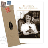 The "I'm Not Bossy What A Hoot Card" by Shannon Martin Design features a vintage photo of a smiling woman with gold text. Made from recycled paper, it comes with a brown envelope adorned with old postage stamps.