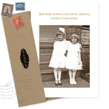 The She Who Finds Birthday Card by Shannon Martin Design features two young girls on steps and the quote “She who finds a faithful friend, finds a treasure.” Made in the USA, it includes an envelope with vintage stamps for nostalgic charm.