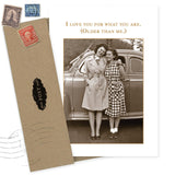 The Shannon Martin Design "What You Are Birthday Card" features two women smiling by a vintage car and gold text: I love you for what you are. (Older than me.) Includes envelope and postage stamps. Made in the USA.