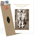 The Count Twice Thank You Card by Shannon Martin Design features two kids in checkered costumes and an Irish Blessing: "When I count my blessings, I count you twice." Made in the USA, comes with a brown envelope.