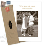 The Too Young Birthday Card by Shannon Martin Design features two women in vintage outfits with "We're much too young to be this old." Includes vintage stamps and a brown recycled paper envelope.