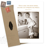 The Give A Girl Shoes Birthday Card by Shannon Martin Design features a vintage photo of a young girl at the sink and the quote, "Give a girl the right shoes, and she can conquer the world," complete with two envelopes and nostalgic stamps.