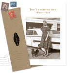The What Time? What A Hoot Card by Shannon Martin Design features a vintage photo of a woman in a dress with her small dog by a classic car and the phrase, “That’s a horrible idea. What time?” Includes envelope with old stamps; made from recycled paper.