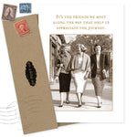 The Friends We Meet Friendship / Just Because Card by Shannon Martin Design features a sepia image of three women arm-in-arm, with the message, “It’s the friends we meet along the way that help us appreciate the journey.” Envelope with vintage stamps included.