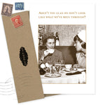 The “Aren’t You Glad Birthday Card” by Shannon Martin Design shows two women chatting at a restaurant and features a vintage-style envelope. The recycled paper card reads, “Aren’t you glad we don’t look like what we’ve been through?”.