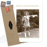 The First Rodeo Birthday Card by Shannon Martin Design features a sepia photo of a smiling cowgirl twirling a lasso and reads, "Actually, this is my first rodeo." Includes vintage-style envelope. Made in USA.