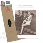 The Shannon Martin Design "Don't Get Started" Birthday Card features a smiling woman in a polka dot outfit in a classic car with the quote, "Don’t get me started. I don’t come with brakes." Includes envelope with vintage stamps. Made in USA.