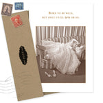 The Born to Be Wild Birthday Card by Shannon Martin Design features a sepia photo of a woman relaxing barefoot on a striped couch with the caption, "Born to be wild, but only until 9pm or so." Made in the USA, envelope included.