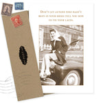 The Tie Your Laces What A Hoot Card by Shannon Martin Design features a sepia photo of a smiling woman on a vintage car with the phrase, “Don’t let anyone who hasn’t been in your shoes tell you how to tie your laces,” and comes with a brown envelope.