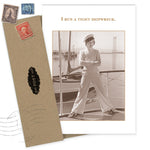 The Shannon Martin Design “Tight Shipwreck Birthday Card” features a sepia photo of a woman in nautical attire on a boat, captioned “I RUN A TIGHT SHIPWRECK,” with vintage-style envelope and stamps for a classic look.