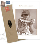 The Melon Thank You Card by Shannon Martin Design features a sepia photo of a child in a cap eating watermelon with "You're one in a melon" above. Made in the USA, it includes a brown envelope with vintage stamps and a postal seal.