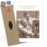 The Heart Anniversary Card by Shannon Martin Design features a vintage photo of a smiling couple in a car and reads, "You have my whole heart, for my whole life." Includes kraft envelope with old stamps and black POST seal.