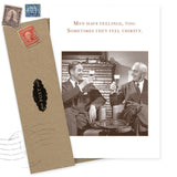The Men Have Feelings Birthday Card by Shannon Martin Design features two men in suits smiling and raising beer glasses with the caption, "Men have feelings, too. Sometimes they feel thirsty." Includes a brown envelope with postage stamps.