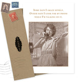 The Amaze Myself Birthday Card by Shannon Martin Design features a vintage woman in an apron, surprised with a phone and spatula. The message reads: “Some days I amaze myself. Other days I look for my phone while I’m talking on it.”.