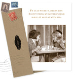 The Glad We Met Birthday Card by Shannon Martin Design features two women laughing over coffee in a vintage-style photo. The card reads, "I'm glad we met later in life," and comes with an envelope made from recycled paper and old stamps.