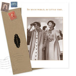 The World Birthday Card by Shannon Martin Design features a sepia photo of two women in coats, one with binoculars, and the words "So much world, so little time." Made in the USA, it includes an envelope with vintage postage stamps.
