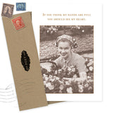 The Shannon Martin Design "Full Heart Thank You Card" features a sepia photo of a smiling woman in a headscarf among flowers with the message, "If you think my hands are full you should see my heart." Comes with a brown envelope and vintage stamps. Made in the USA.