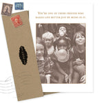 The Make Life Better Birthday Card by Shannon Martin Design features a sepia photo of five kids blowing bubble gum, made with recycled paper and paired with a brown envelope. The card reads: "You’re one of those friends who makes life better just by being in it.