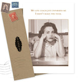 A sepia-toned vintage photo on the Shannon Martin Design Life Coach Birthday Card shows a woman looking disappointed, with text above: “My life coach just informed me I didn’t make the team.” An envelope with vintage stamps is beside the card.