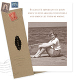The Simply Let Them Be Wrong What A Hoot Card by Shannon Martin Design features a sepia photo of a smiling woman on a beach and the quote, “In life it’s important to know when to stop arguing and simply let them be wrong.” Includes envelope with vintage stamps.