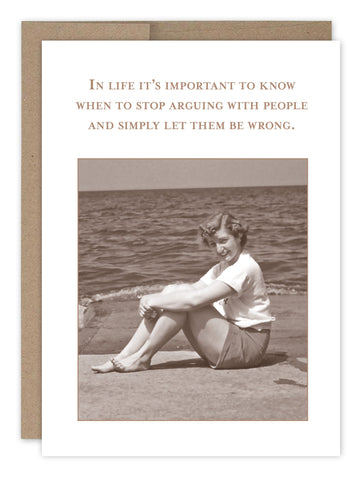 The Let Them Be Wrong What A Hoot Card by Shannon Martin Design features a sepia-toned image of a smiling woman by the water with the quote: In life its important to know when to stop arguing with people and simply let them be wrong, mounted on recycled kraft paper for a nostalgic feel.