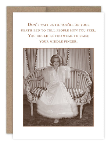 Sepia-toned image of a smiling woman in an elegant dress on a vintage couch. Text says: Dont wait to share your feelings; you might be too weak to raise your middle finger. Product: Tell People Birthday Card by Shannon Martin Design.