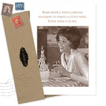 The Shannon Martin Design Special Occasion Birthday Card features a sepia photo of a smiling woman with wine, includes an envelope with vintage stamps, and is made in the USA—a delightful way to celebrate any birthday.