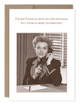 The Mind My Own Business Birthday Card by Shannon Martin Design features a vintage-style image of a smiling woman with a telephone, notepad, and pen, plus the text: I know I should mind my own business, but yours is more interesting. Made in the USA.