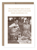 The Sandwiches Birthday Card by Shannon Martin Design features a vintage photo of a smiling man and woman picnicking on a blanket. Printed on recycled paper, it reads: I’m glad I don’t have to hunt for my food. Perfect for birthdays!.