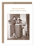 Two women in vintage outfits stand by a fountain—one drinks, the other chats. Text above: Too bad bitching doesn't burn calories. The "Too Bad Birthday Card" by Shannon Martin Design is a witty choice for anyone who loves vintage style and humor.