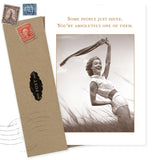 The Some People Just Shine Congratulations Card by Shannon Martin Design features a sepia photo of a smiling woman in retro swimwear with uplifting text, plus a brown envelope with vintage stamps—perfect for celebrating friendship.