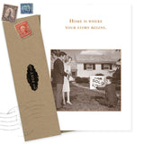The Where Your Story Begins New Home Card by Shannon Martin Design features a sepia vintage photo of a couple and agent by a SOLD sign with the phrase "Home is where your story begins." Includes envelopes and vintage stamps.