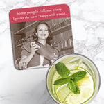The Happy With A Twist Coaster by Shannon Martin Design features a smiling woman shaking a cocktail and the caption “Some people call me crazy. I prefer the term ‘happy with a twist.’” Cork-backed, heat and water resistant—ideal for your drink.
