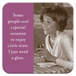 In a black-and-white photo, a woman smiles with a wine glass, her sparkly top and pearl necklace gleaming. Next to her, purple text reads: Some need an occasion for wine. I just need a glass—and Shannon Martin Designs Special Occasion Coaster as the perfect hostess gift.