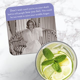 The Tell People Coaster by Shannon Martin Design features a vintage photo of a woman in white on a sofa, with witty text. Cork-backed for durability, it makes the perfect hostess gift and is shown next to a glass of lime and mint water.