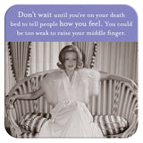 The Tell People Coaster by Shannon Martin Design features a vintage photo of a glamorous woman on a striped sofa with the quote, "Don’t wait until you’re on your death bed to tell people how you feel." Perfect for retro decor or as a unique gift.
