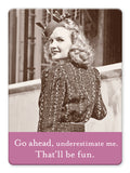 The Go Ahead Magnet by Shannon Martin Design features a vintage-style woman in a patterned dress with the quote “Go ahead, underestimate me. That’ll be fun.” A unique fridge magnet for fans of retro photography.