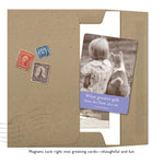 The Shannon Martin Design "Love Of A Cat Magnet" includes a brown folder with vintage stamps, a greeting card featuring a sepia child-and-cat photo, and a sturdy magnet, with the card quoting, “What greater gift than the love of a cat.”—Charles Dickens.