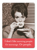 A woman with styled hair sips tea from a floral teacup; beneath her, the caption says: I don’t like morning people. Or mornings. Or people—perfect humor from the Morning People Magnet by Shannon Martin Design for your fridge.