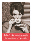 In a black and white image, a woman sips tea from her cup with a saucer in hand. Bold text reads: I don’t like morning people. Or mornings. Or people. Below, contrasted by a red banner with white text is the Morning People Magnet by Shannon Martin Design.