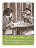 The Glad We Met Magnet by Shannon Martin Design features two women in vintage attire chatting at a café with the caption, "I’m glad we met later in life." This witty fridge magnet makes a perfect gift for friends.