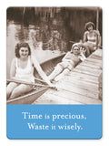 Three women in vintage swimsuits relax lakeside—one in a canoe, one on the dock, and one by the edge. The Time Is Precious Magnet by Shannon Martin Design features the text: Time is precious, Waste it wisely. Perfect for gift or photo magnets.