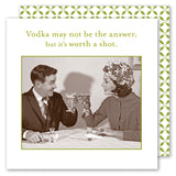 A man and woman in vintage attire toast martinis on Shannon Martin Design’s "It's Worth a Shot Napkin.