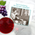 The Shannon Martin Design "Same Age Napkin" features a black-and-white photo of two women laughing with the caption, “Isn't it weird being the same age as old people?” and is perfect for parties.